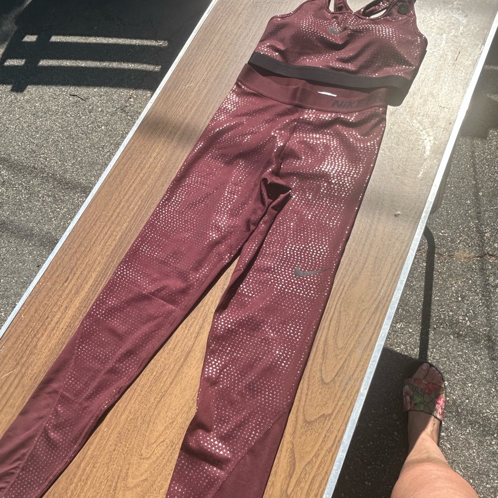 Burgandy Nike dri fit  leggings with metallic detail